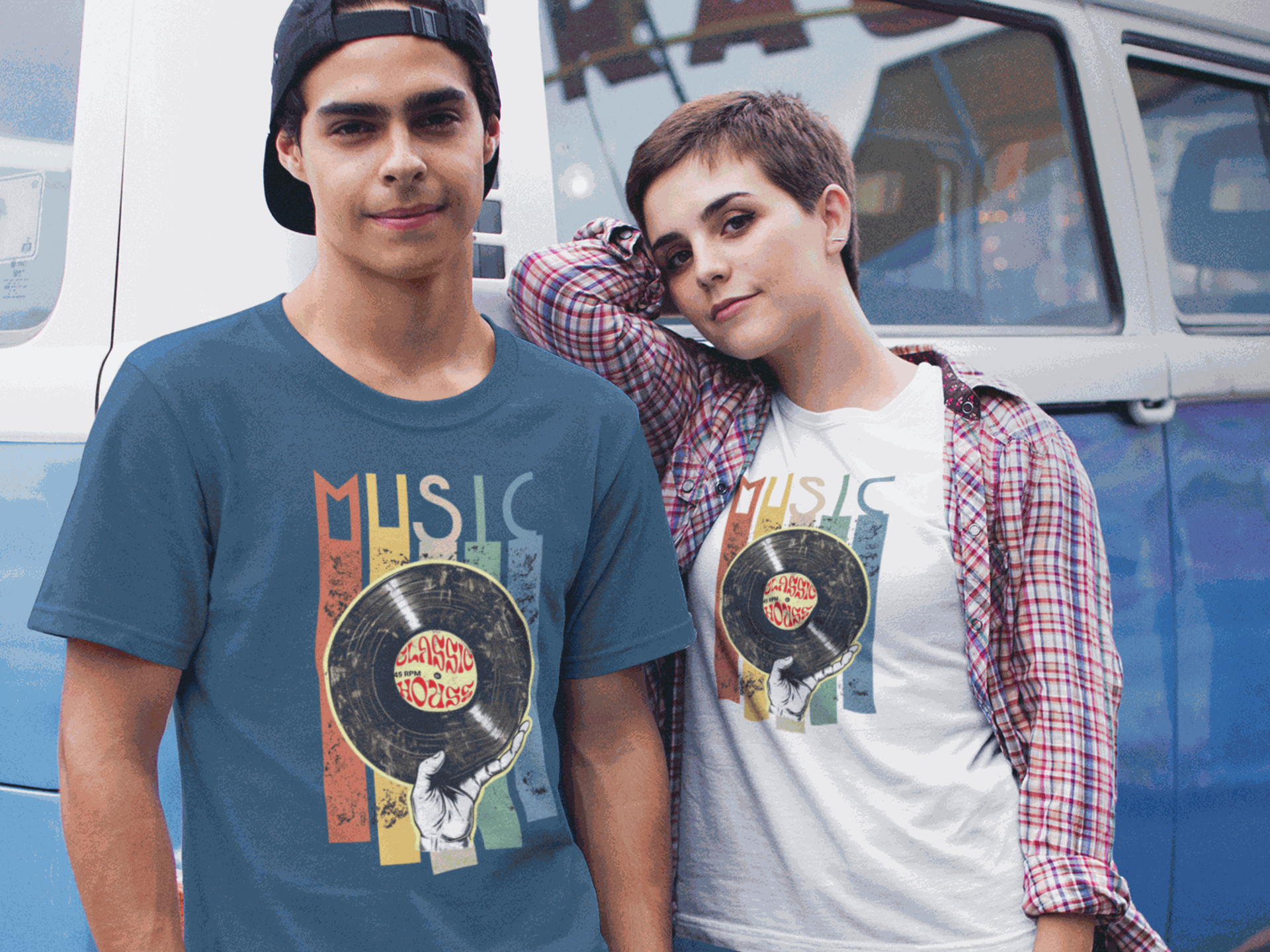 Two young adults wearing Retro Music Vinyl T-Shirts with colorful vinyl record design, standing by a vintage vehicle.
