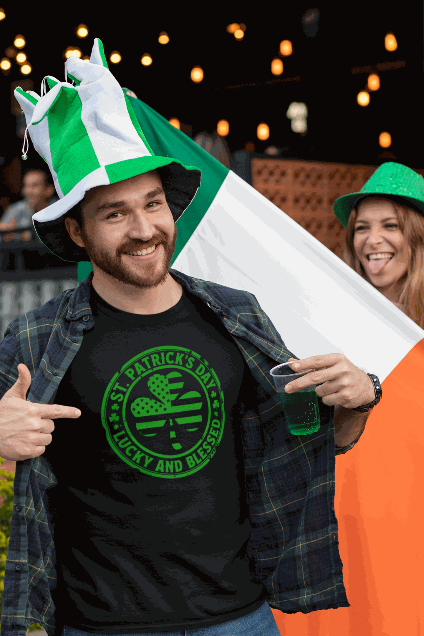 Man wearing St. Patrick's Day Lucky and Blessed shamrock tee with green and white hats and Irish flag background